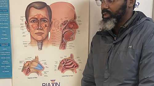 visual aid of white male in doctor's office